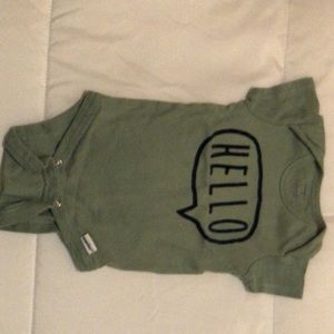a mint green baby onesie